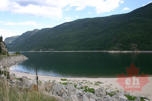 Sandy beach outcropping on lake Sandy Beach on Lower Arrow Lake lake 003.jpg