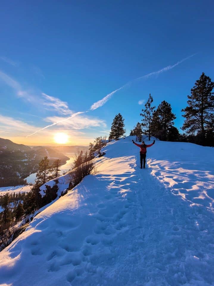 Girl winter hiking at sunset in the North Okanagan