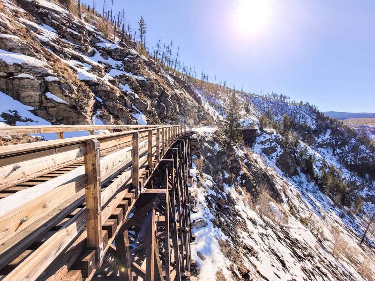 Spring Hiking Trails in British Columbia. Wooden train bridge lightly covered in snow