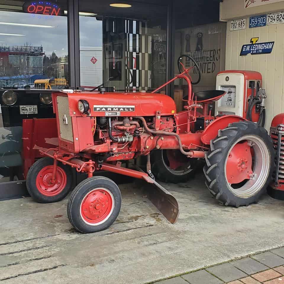 An old tractor and gas pump at the BC Vintage Truck Museum in Surrey British Columbia Canada.