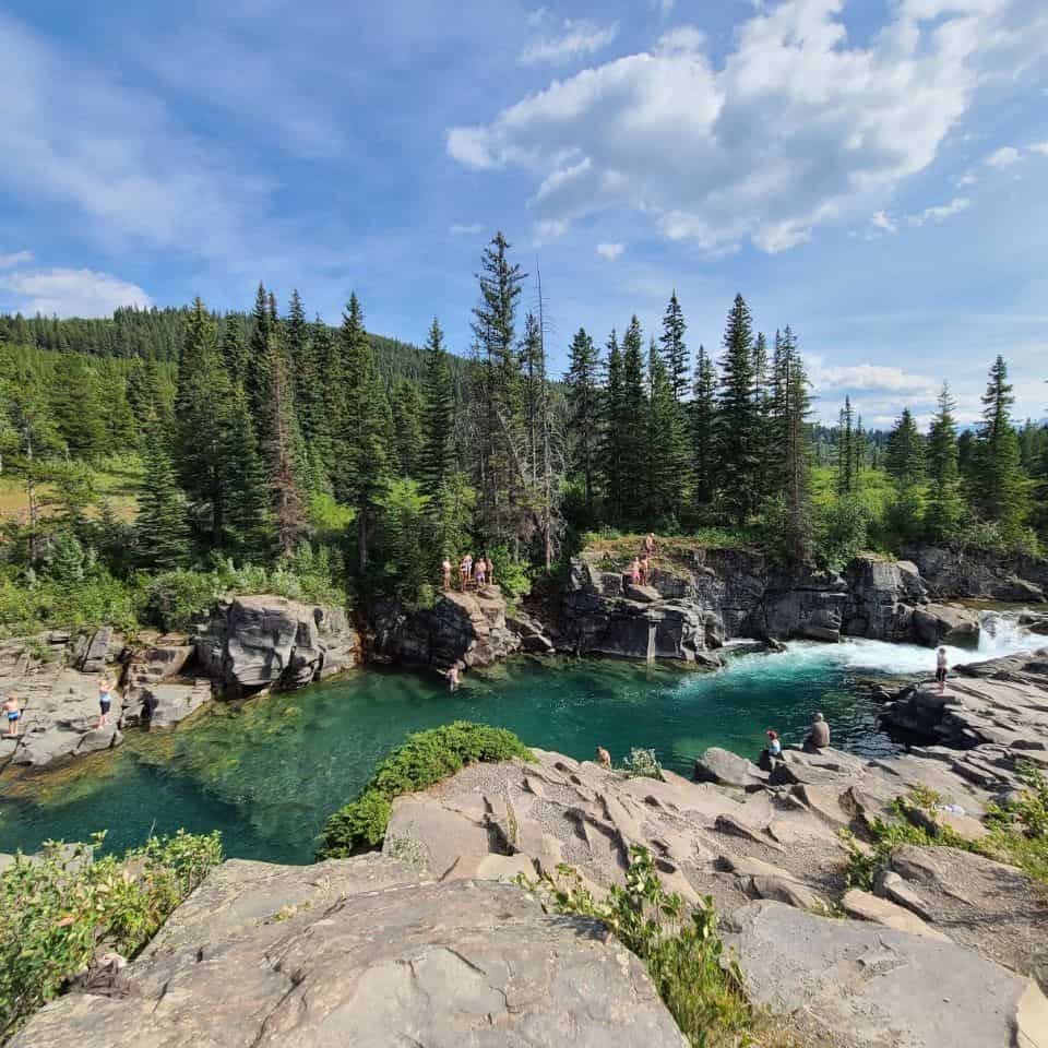 Castle Provincial Park Waterfall is an adventure destination popular for tubing and swimming near Calgary Alberta.