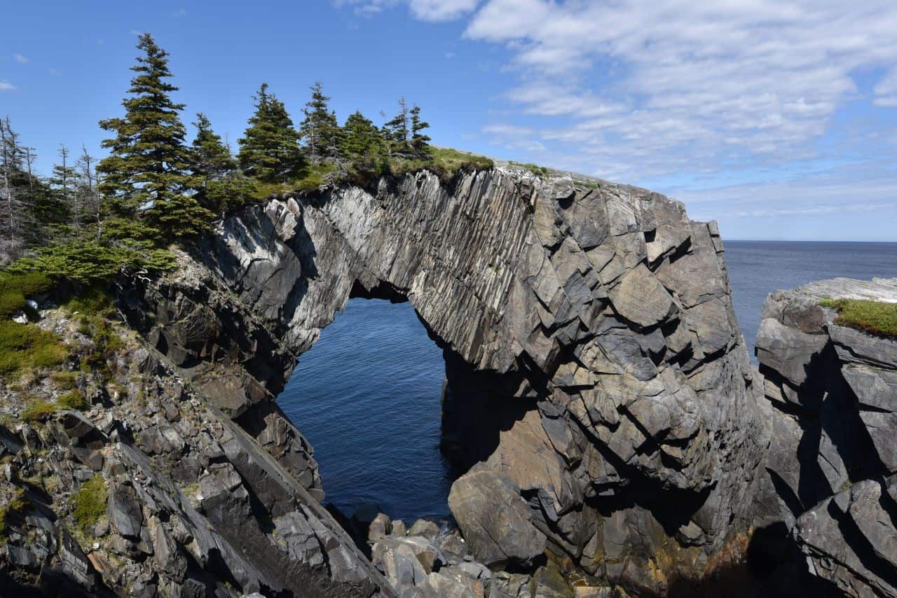Famous natural features like the Berry Head Arch on the Spurwink Island Path are located along the length of Newfoundland's East Coast Trail