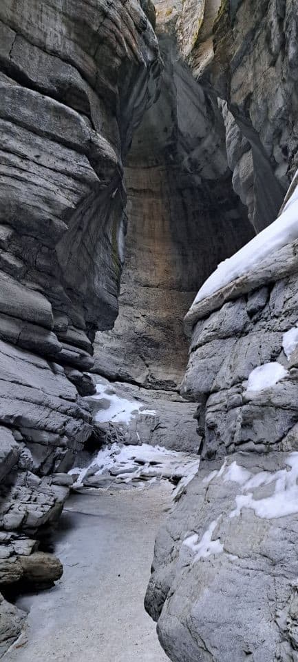Maligne Canyon's walls tower overhead. The limestone has been eroded for thousands of years in what is known as karst topography.