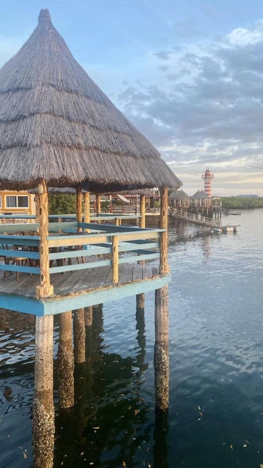 Tranquil waters flow underneath this quaint seaside restaurant in Honduras