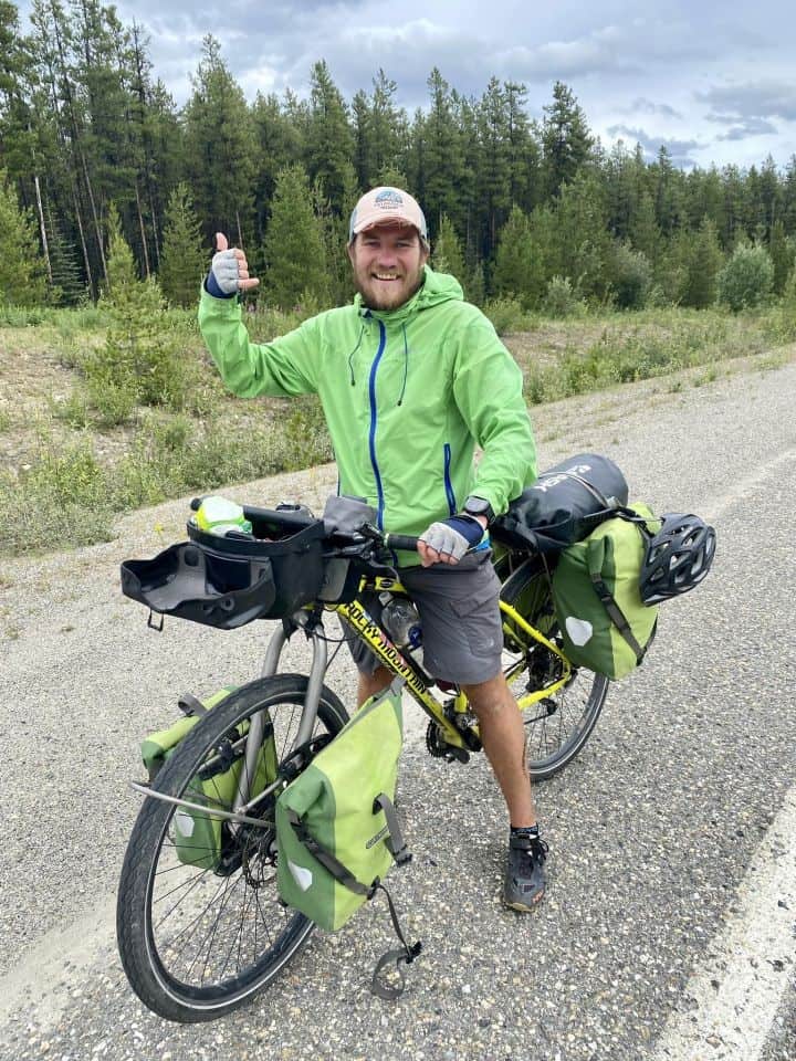 Making friends with another adventure cyclist on the highway in the Yukon. This bikepacker is from Russia.
