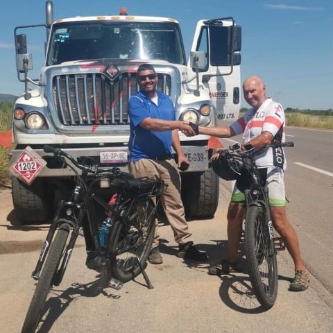 A trucker stops to speak to Robert Fletcher and buys him lunch