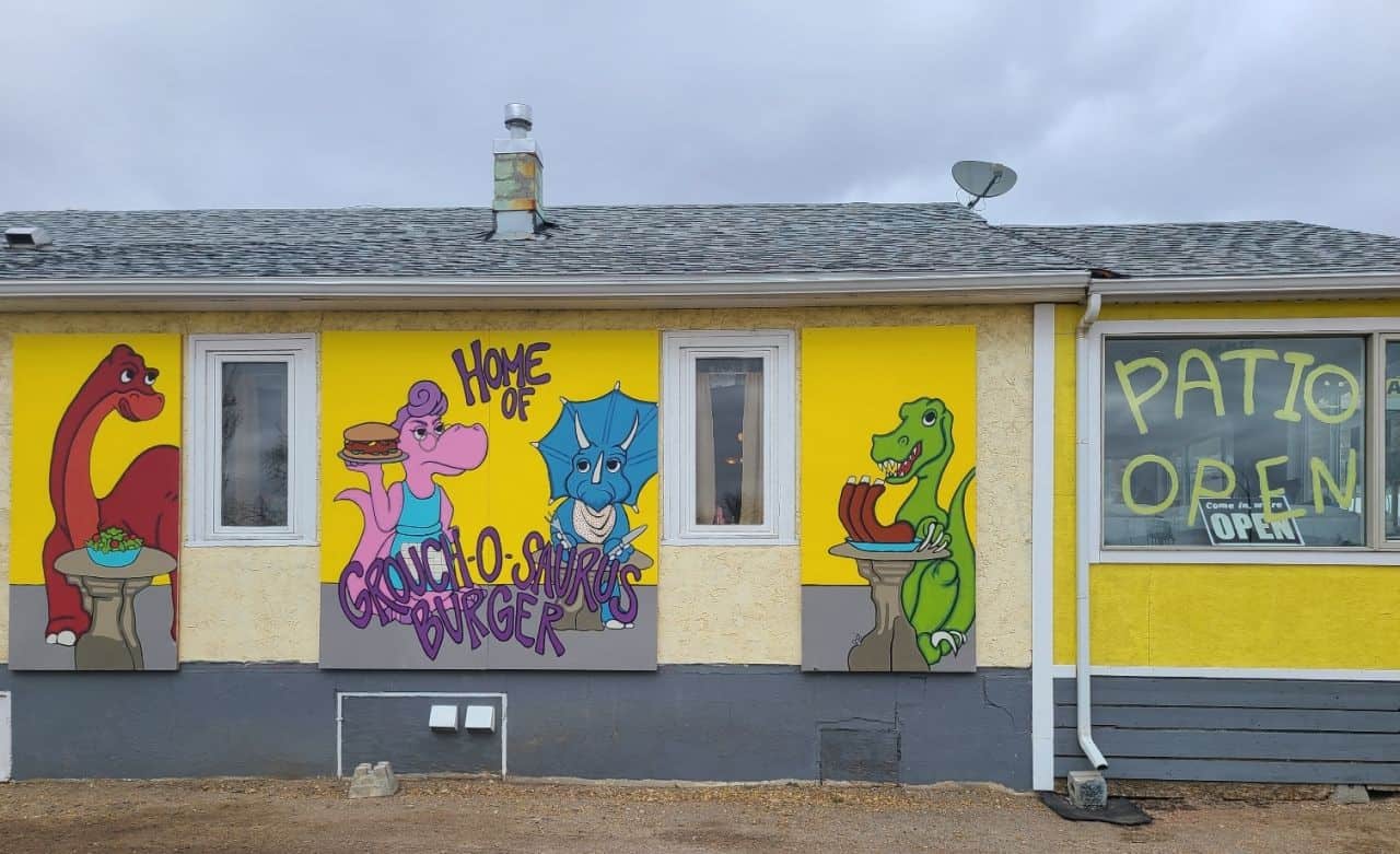 A fun dinosaur mural on the side of a Drumheller restaurant, Old Grouches