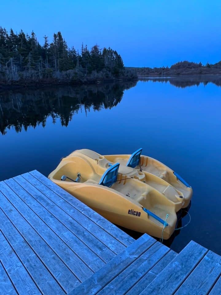 Complimentary pedal boat at the cottage dock during dusk in Newfoundland Canada.