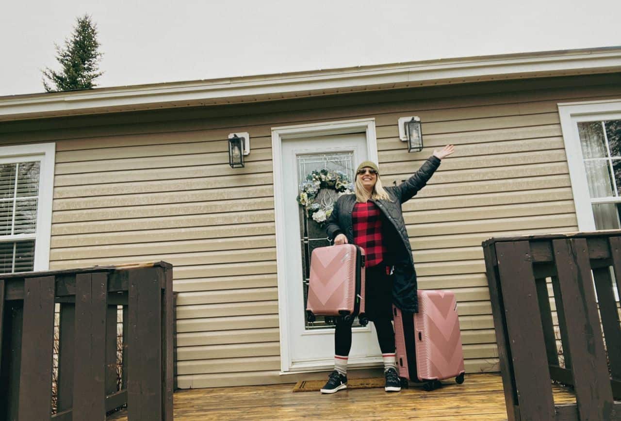 Step front door cabin cottage luggage suitcases suitcase plaid nl Newfoundland spring east
