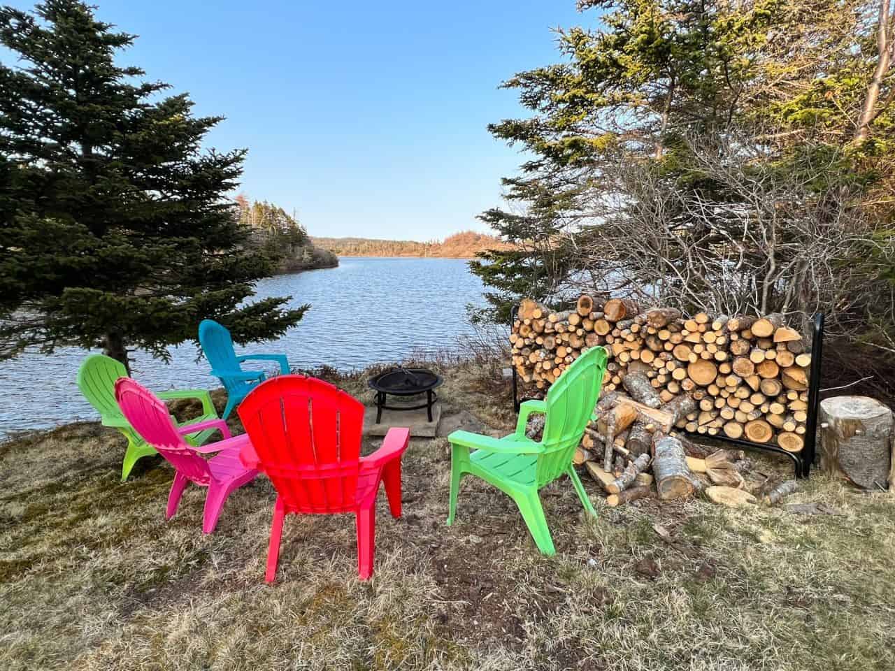 Chairs colourful wood firewood pond like trees nl cottage cabin Newfoundland Canada country