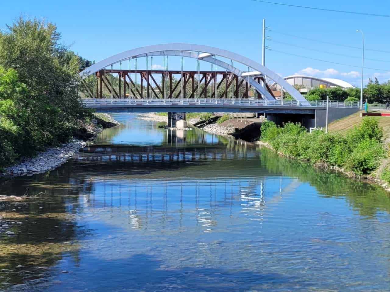 Pedestrian bridges over the stunning Bow River and its tributaries offer tranquil water views to hikers and cyclists on the City of Calgary Trails.