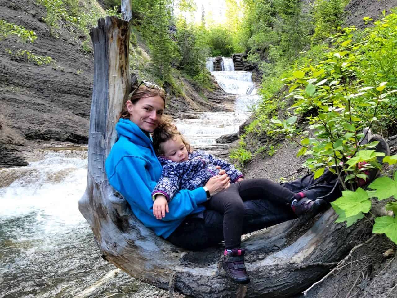 Family time at Allison Creek Falls in the Crowsnest Pass in Southern Alberta Canada.