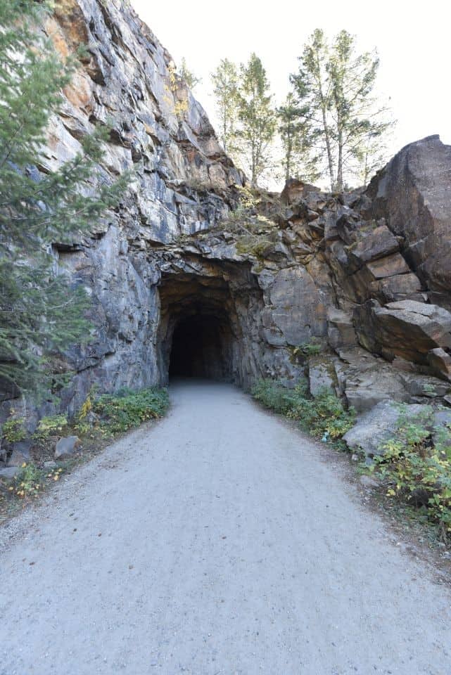 Cyclists and hikers can explore two tunnels as well as 18 wooden trestle bridges while enjoying spectacular scenery in Myra Canyon, BC, Canada.