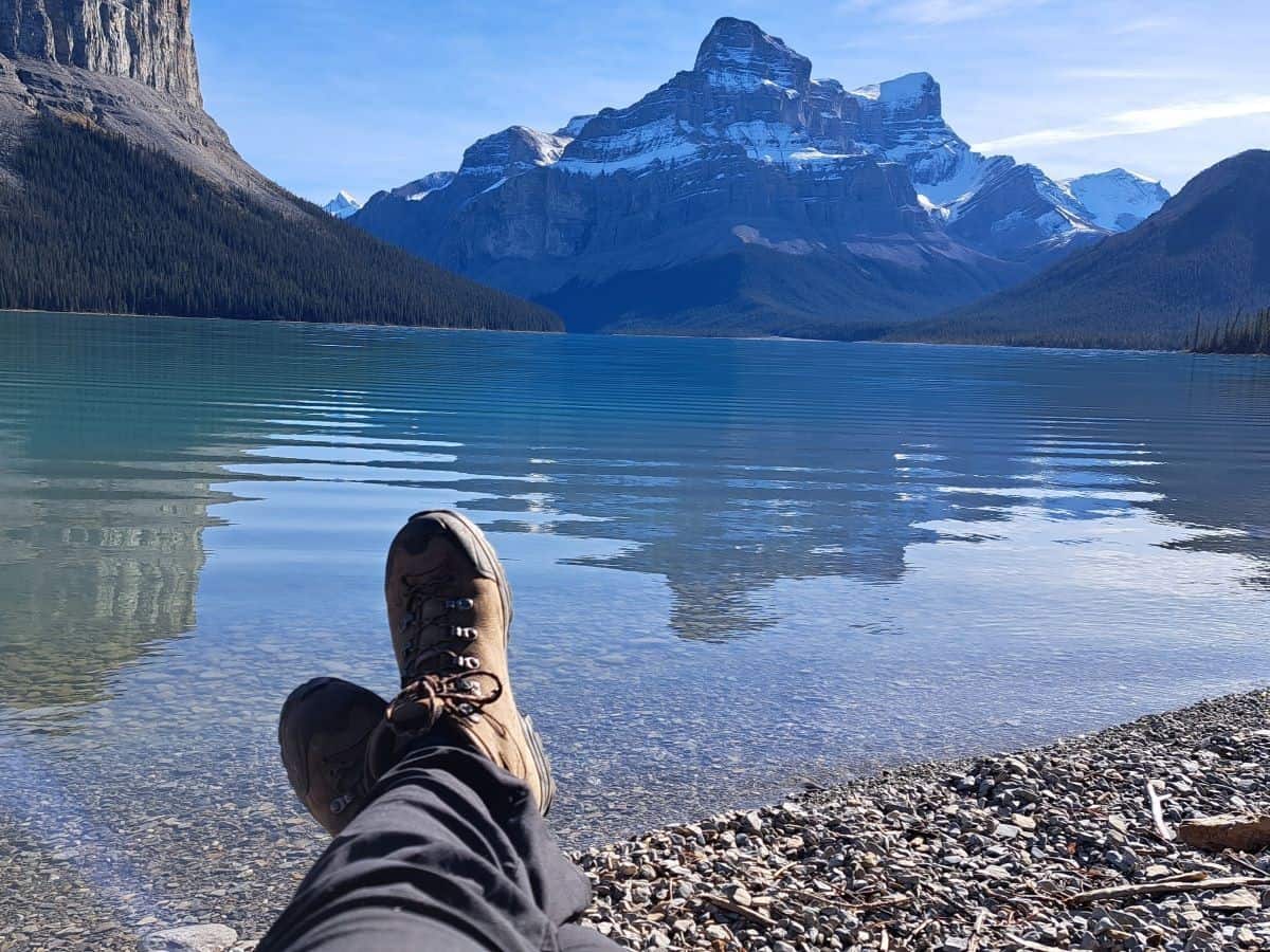 Sitting on the beach and looking south towards Coronet Creek from the Spindly Creek Picnic Area on Maligne Lake