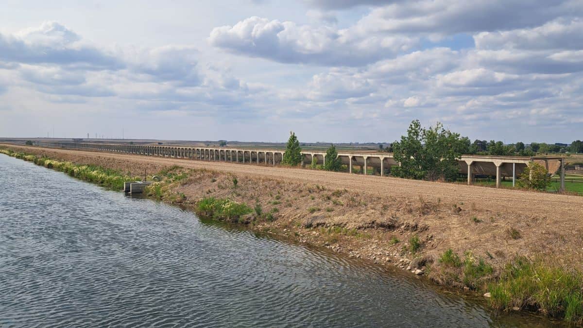 The decommissioned Brooks Aqueduct lies parallel to the new efficient canal irrigation system