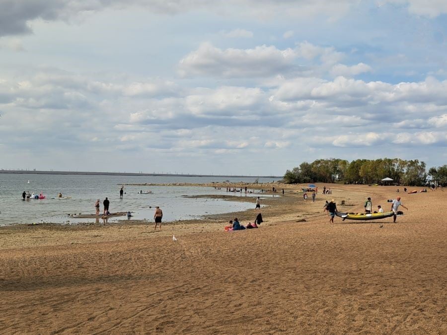 Visitors enjoying swimming, watersports and relaxing on the beach at Kinbrook Island Provincial Park near Brooks Alberta Canada