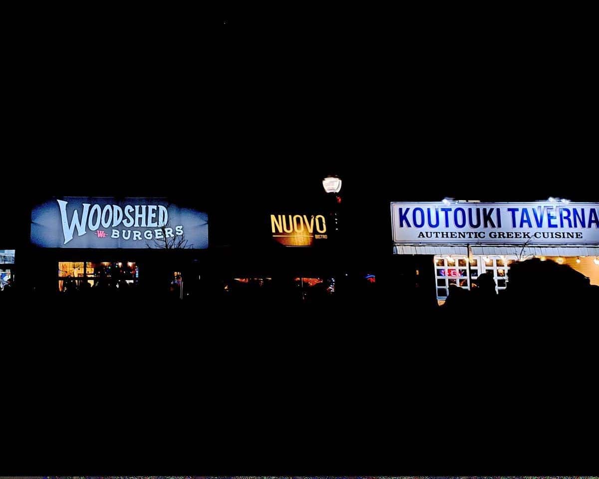 The original Woodshed Burgers with neighbours, Nuovo Italian Bistro and Koutouki Taverna Greek Restaurant on 124 Street in Edmonton Alberta Canada. A great destination for foodies.