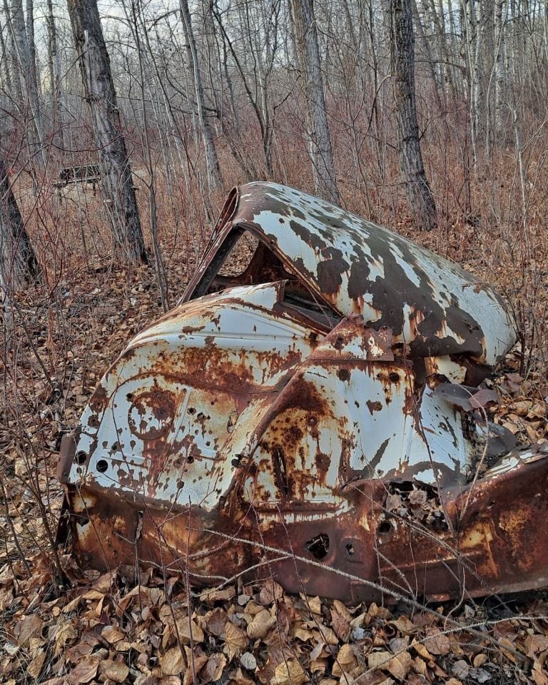 You never know what you will encounter on the trail in the fall, after the leaves have fallen. This old rusty truck somehow managed to get down to the bottom of the valley in between the two sets of stairs on the River View Trail in Parkland County.