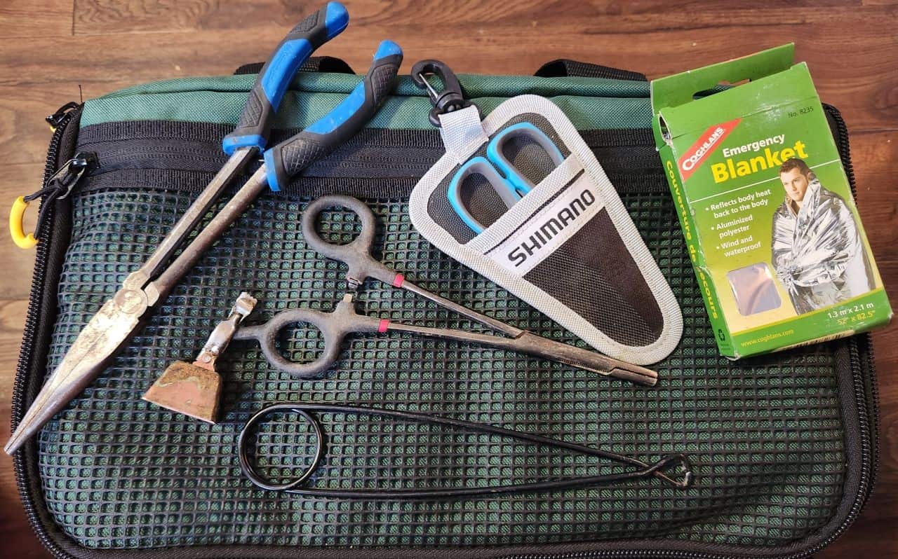 Pliers bells emergency blanket as well as scissors are a few much have items on your ice fishing checklist.