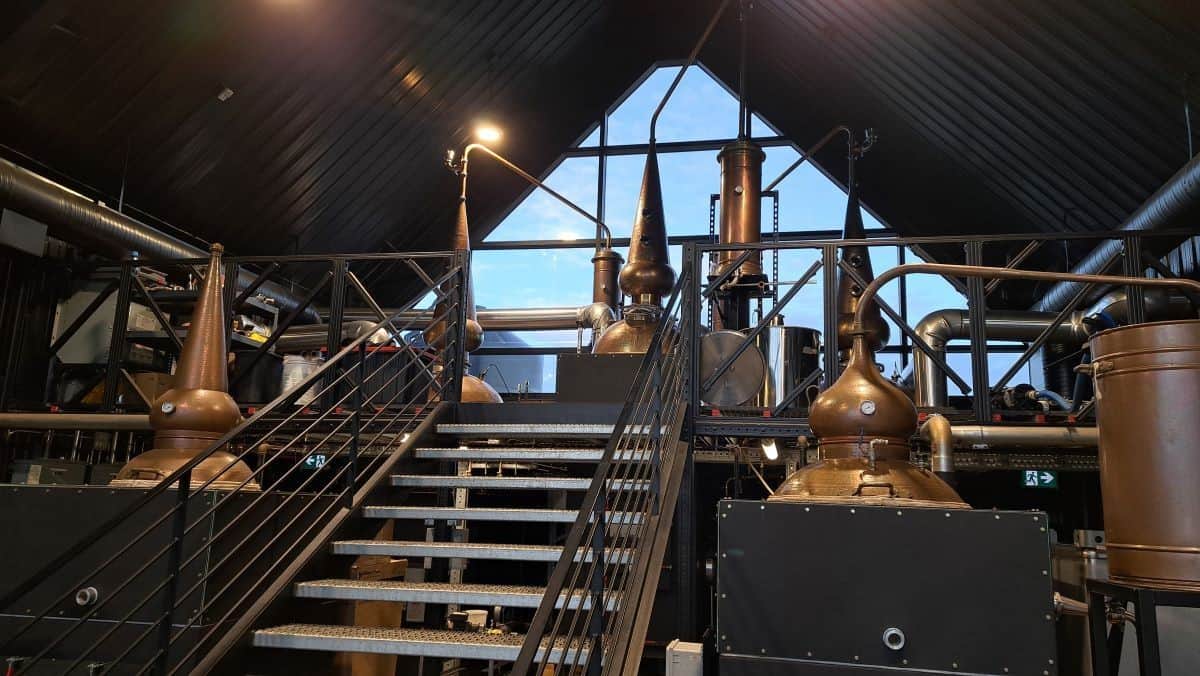 A natural gas flam is used to create a direct fire method of heating the still above at Anohka Distillery in Parkland County Alberta