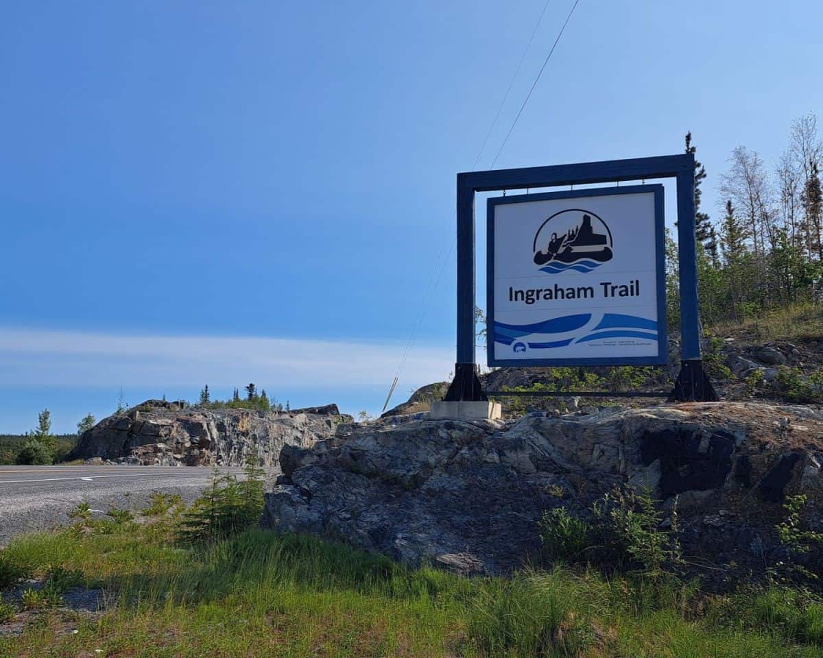 A sign marks the start of the Ingraham Trail just outside of Yellowknife NWT.