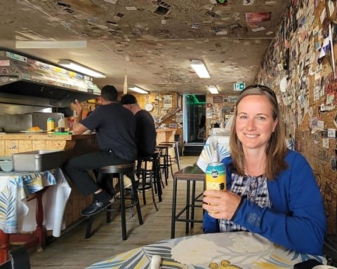 Eh Canada Adventure Seeker, Janet Guthrie enjoys a local craft beer while waiting for lunch at Bullock's Bistro in Yellowknife.