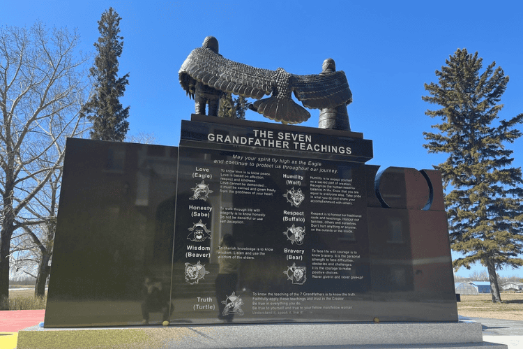 Back of the Muscowequan Residential School monument: May your spirit fly high as the Eagle and continue to protect us throughout our journey.