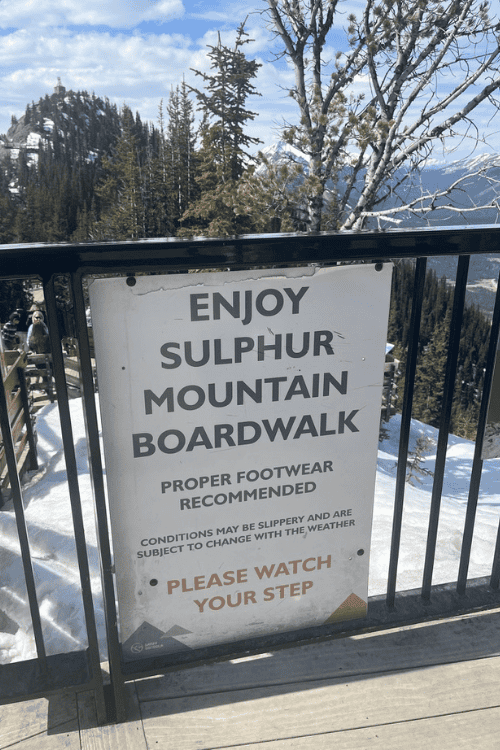 Sign: Enjoy Sulphur Mountain Boardwalk, proper footwear recommended.