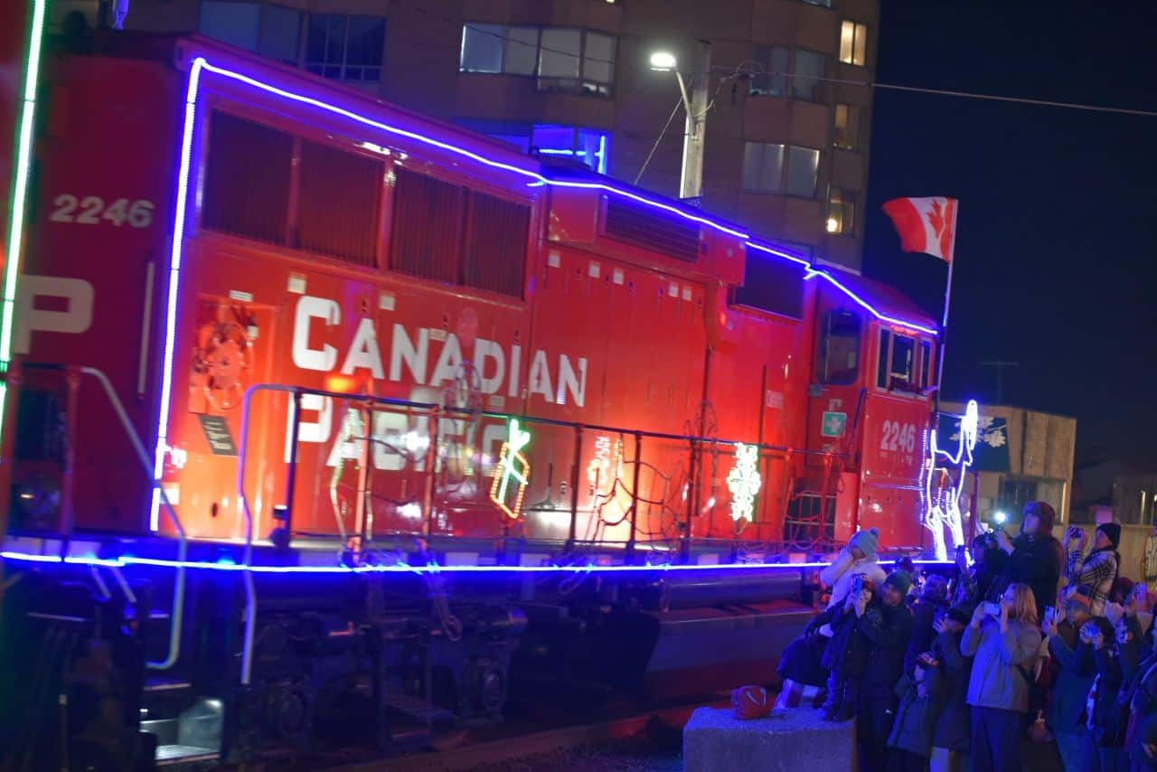 Excited crowds gather in London, Ontario, to welcome the CPKC Holiday Train with cheers and anticipation. The festive atmosphere embodies the spirit of the CPKC Holiday Train Crosses Canada: A Magical Winter Tradition.