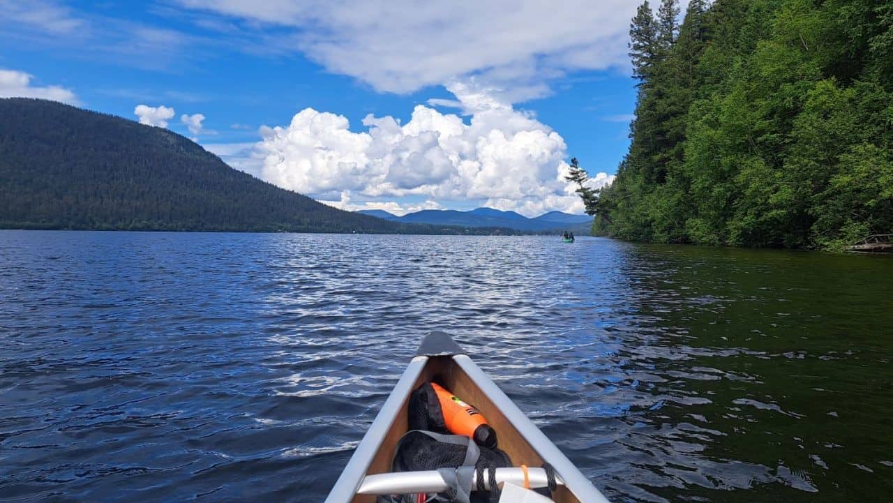 The front of the canoe points to the end of Bowron Lake and the end of the 7-day backcountry Bowron Lake Canoe adventure