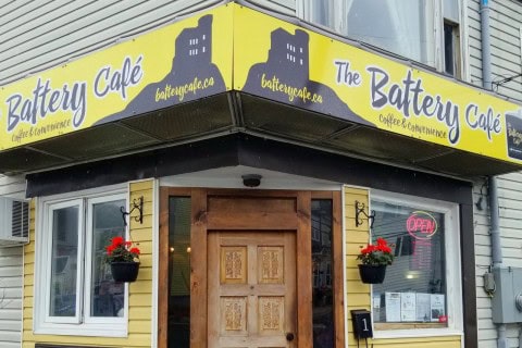 The Battery Café’s charming exterior in St. John’s, Newfoundland welcomes visitors with coastal views and colourful surroundings, offering a cozy stop for coffee, breakfast, and a gateway to nearby North Head Trail adventures.