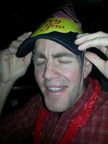 Passengers celebrate New Year’s Eve in the dome car aboard VIA Rail’s The Canadian, raising glasses beneath starlit skies as the train rolls through snow-covered mountains in the Canadian Rockies.