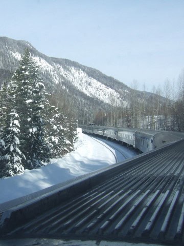 VIA Rail’s The Canadian winds into the snow-covered Rocky Mountains, where towering peaks and deep valleys mark the dramatic transition from Prairie landscapes to alpine winter scenery in Jasper National Park.