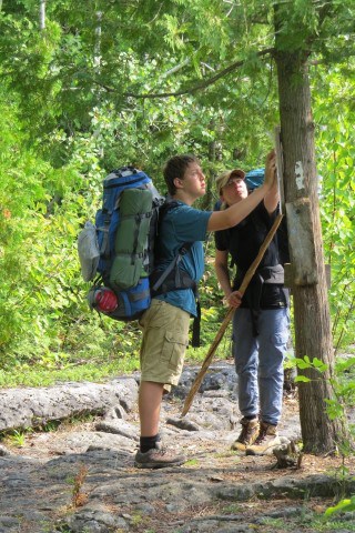 Come Walk With Us thru-hiking the Bruce Trail Peninsula Section along the Niagara Escarpment in Ontario Canada, demonstrating long-distance hiking across rugged limestone cliffs, forests, and shoreline landscapes near Tobermory.
