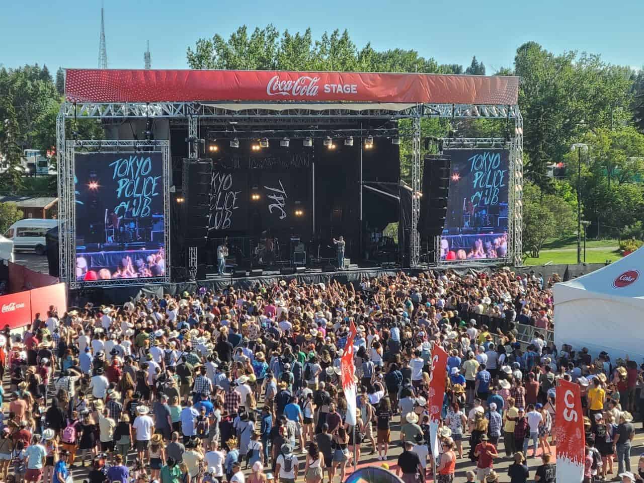 Crowd watching a live concert at the Calgary Stampede Coke Stage outdoor music venue in Calgary Alberta