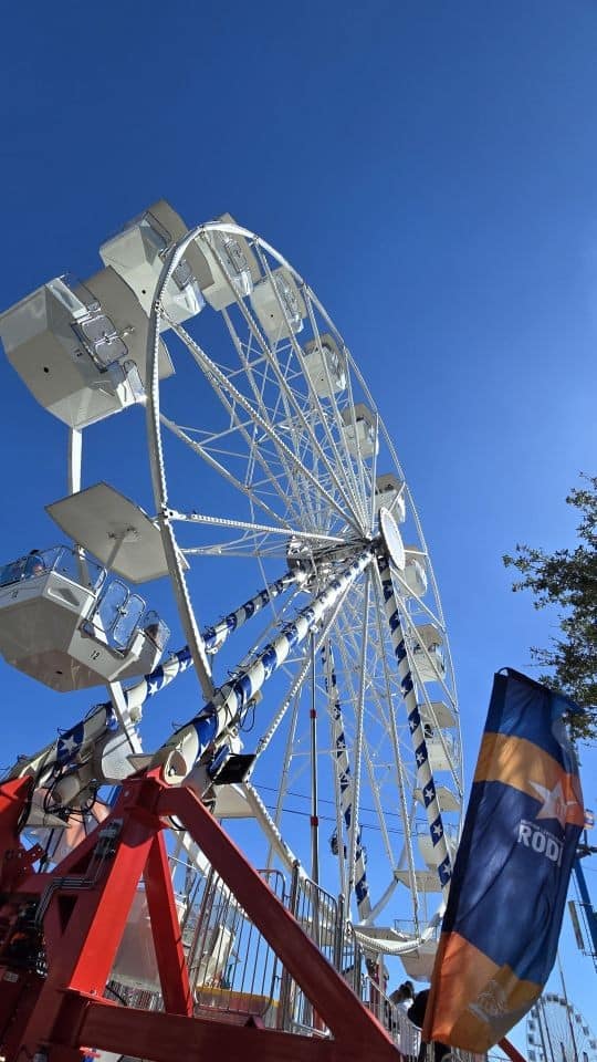 Open-air Ferris wheels like this are a common sight at the Houston Rodeo midway.