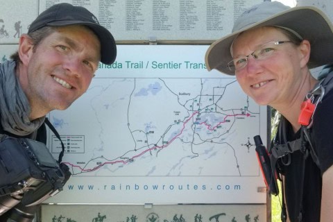 Pilgrims pause at a Sudbury Camino trail map to plan their route, highlighting the accessibility, clear signage, and flexible stages of this Northern Ontario urban Camino hiking experience.