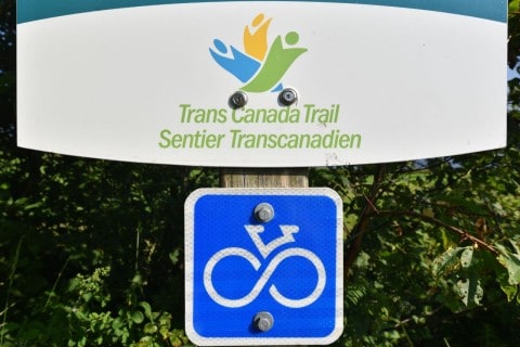 The Trans Canada Trail network combines cycling trails, rural roads, and shared routes across Canada, making route planning, bike choice, trail conditions, and connectivity important for long-distance touring cyclists.