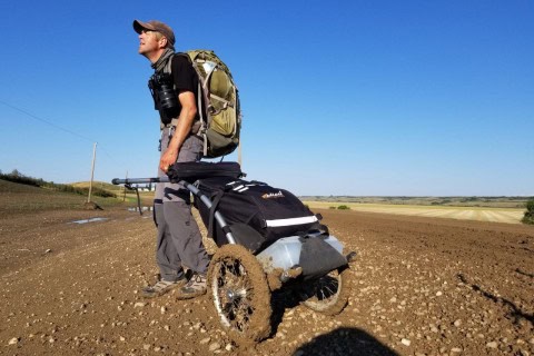 A moment on the Trans Canada Trail in the Canadian Prairies where travel becomes difficult, showing how cycling routes can shift from open gravel paths to mud, slowing progress and changing expectations on the ground.