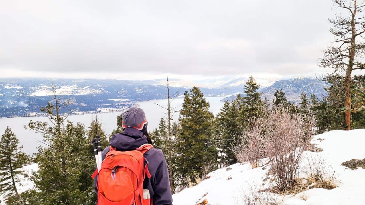 Girl looking over Okanagan Lake on a hiking trail at Predator Ridge.