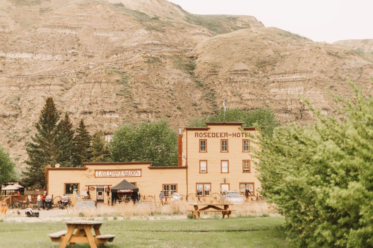 Historic Rosedeer Hotel with the Last Chance Saloon in front, a heritage wooden building in Drumheller, Alberta.