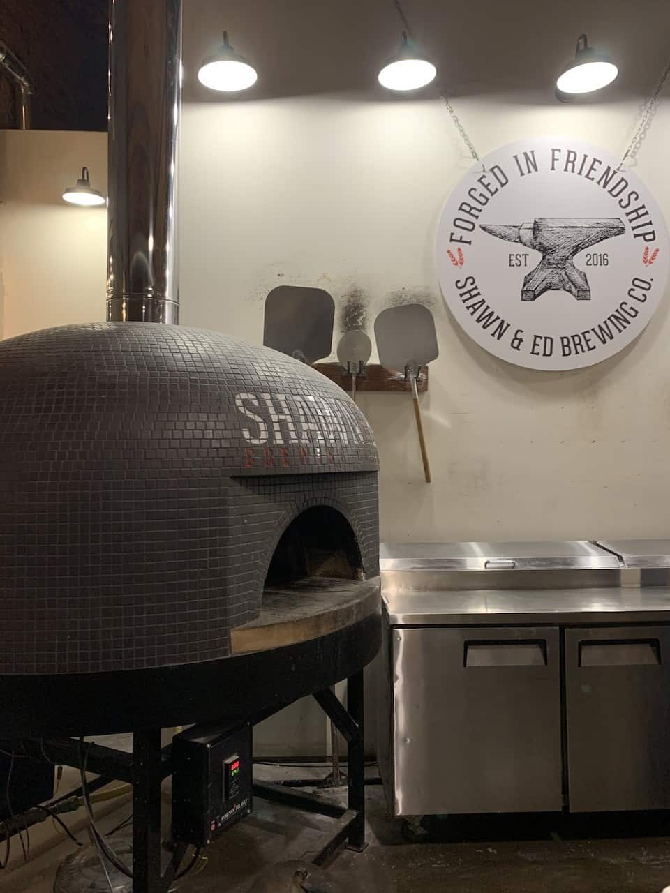 Wood Fired Pizza Oven at Shawn and Ed Brewing Company - The signature wood-fired pizzas at Shawn and Ed Brewing are one of the most popular items on the menu! They offer a wide variety of flavours and toppings.