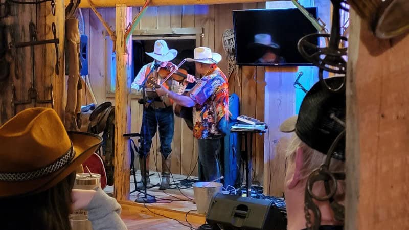 Untitled 2024-05-12 - The owner of the AP Ranch and the band do a fiddle solo to the great surprise of the audience. 
