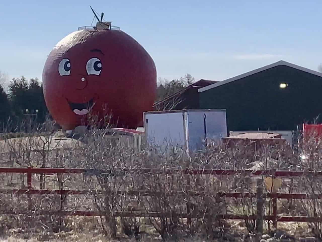 The Big Apple Colborne Ontario Canada  - The massive apple-shaped structure in Colborne, Ontario, Canada is visible from Highway 401. This iconic roadside attraction beckons travellers to pull off and visit The Big Apple.