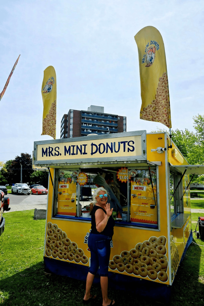 Adventure Seeker Cary getting Mini Donuts at Sarnia Ontario's Poutine Fest  - Adventure Seeker Cary couldn't resist getting some hot & fresh Mini Donuts at Sarnia's Poutine Fest.
Sarnia Ontario Canada 