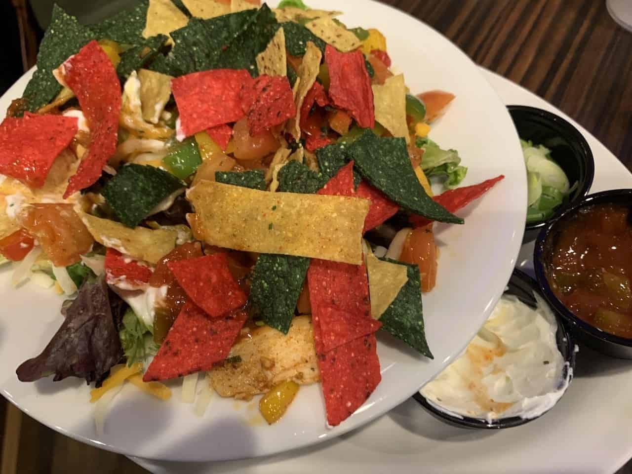 Taco Salad With Chicken - This colourful Taco Salad topped with chicken, was another tasty selection from Horsethief Creek Pub & Eatery's menu in Radium Hot Springs, British Columbia.