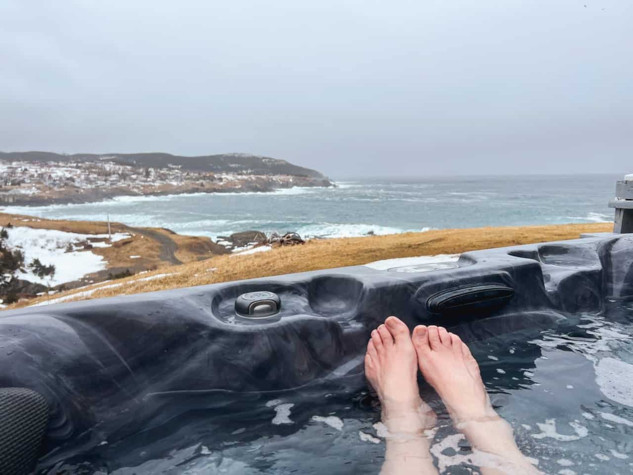 Hot Tub With Ocean View in Pouch Cove Newfoundland Canada  - Hot tubbing with an sing views of the rugged Newfoundland and Labrador coastline is a bucket list activity while visiting the island.  Feel the salty icy wind from the North Atlantic Ocean while you wave watch from the comfort of a luxury spa pool. 