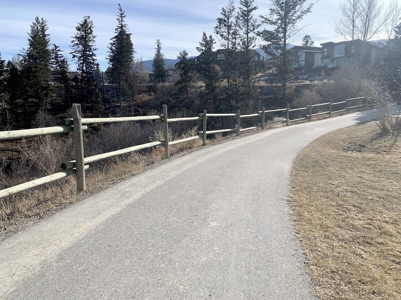 Pathway Around the Outside of Pothole Park - There is a fence-lined, paved walkway around the perimeter of Pothole Park in Invermere, British Columbia.