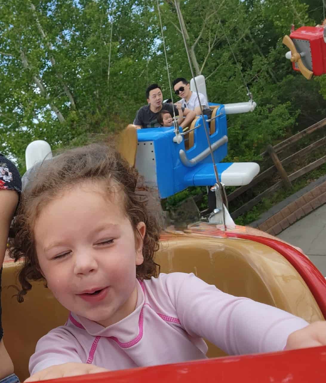 "Weeeeeeee" Kids Love Calaway Park - Flying high in the sky on the kids airplane ride at Calaway Park! I think you can tell by this face that it's a good time.