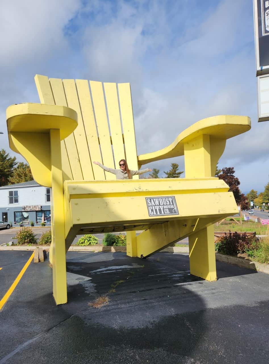 Ginormous Adirondack Chair in Gravenhurst Ontario  - This Adirondack chair is absolutely gigantic. It was not an easy task to climb on, but well worth the effort. You can find this oversized attraction at the Saw Dust City Brewing Mill in Gravenhurst, Ontario. 
